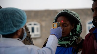 Yemeni woman having her temperature tested