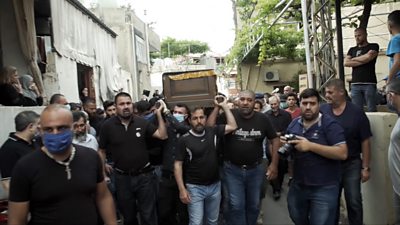Mourners carrying Aya Hashem's coffin through the streets of her hometown of Koleileh, Lebanon