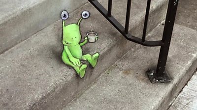 alien-character-sitting-on-some-steps