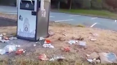 Litter left by a bin in Powys
