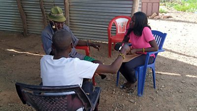 Vivian and her colleague interview villager Mzee Naree about his experience of the flooding