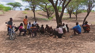 Vivian interviewing members of the community in a safe area