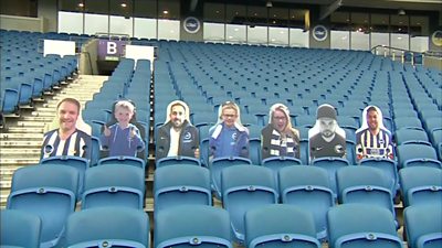 Cut-out supporters in a football stadium