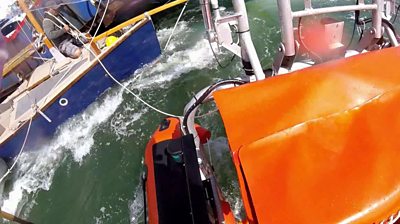 An RNLI crew comes to the aid of a yacht entangled with the Sandbanks Chain Ferry