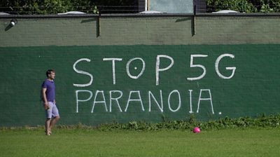 Wall with "Stop 5G Paranoia" graffiti