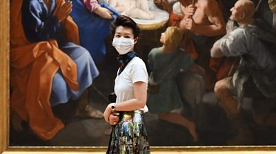 Woman wearing mask in National Gallery, London