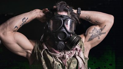 Marine Corp Sgt Reyes wears a gas mask