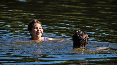 Swimmer in Hampstead pond, London