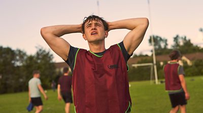 Normal People character Connell has hands behind his head looking vexed during football match