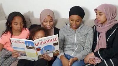 Family reading a book