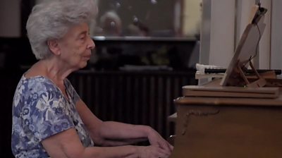 May Melki at her piano in Beirut