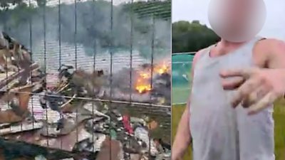 A man claims he was pushed over and had his phone knocked out his hand as he filmed a rubbish fire.