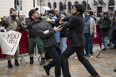 Cormoran Strike (TOM BURKE), Jimmy Knight (NICK BLOOD)(Image Credit: BBC/Bronte Films/Steffan Hill)