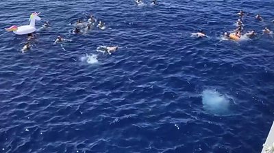 People swimming in ocean