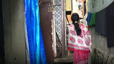 Woman in run-down area