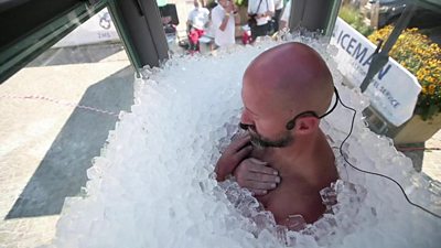 Man in box of ice