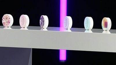 A row of six wearable air purifers