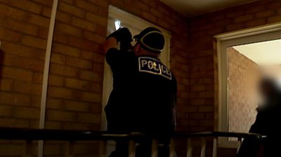 Police entering a house