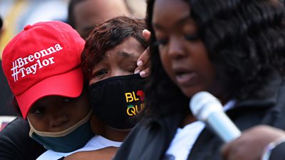 Breonna Taylor's mother Tamika Palmer cries as her sister Bianca Austin speaks