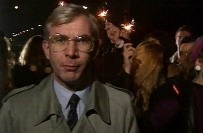 Brian Hanrahan reporting from Berlin - behind him the crowd have sparklers