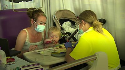 A child plays after surgery