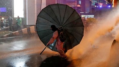 Protester with umbrella