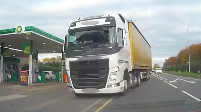 Lorry careering across a road