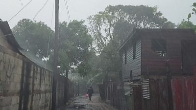 A man walks in heavy rains as Hurricane Iota nears Nicaragua