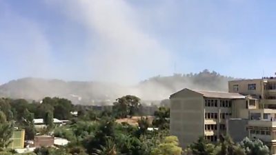 A plume of smoke rising in Mekelle after an airstrike