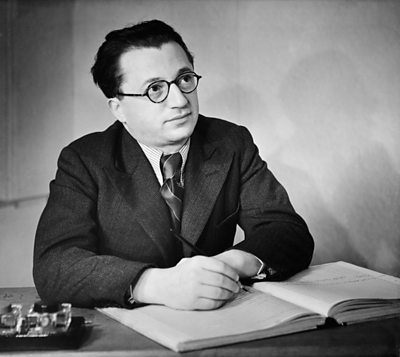 Julius Burger looks dreamily up from a score