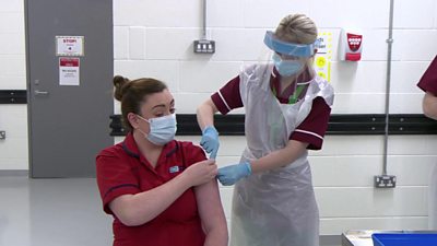 Joanna Sloan receives a Covid-19 vaccine