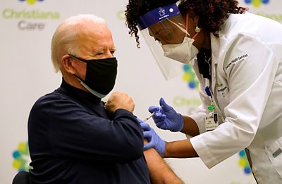 A nurse gives President-elect Joe Biden a Covid-19 vaccine