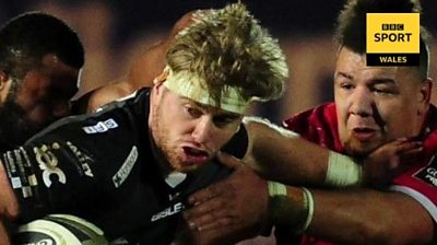 Aaron Wainwright tries to get past Scarlets' Javan Sebastian