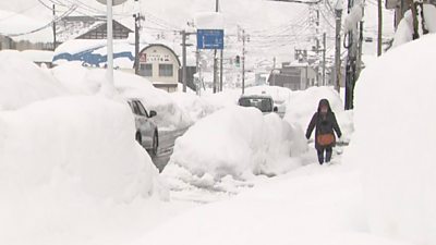 Japan is hit by severe snow storms, killing at least eight and bringing some regions to a standstill.