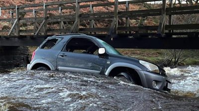 Car trapped in flood