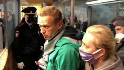 Navalny being detained at the airport