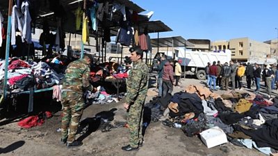 Aftermath of twin suicide bombing at market in Baghdad, Iraq