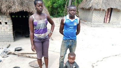 Daniel, Angelina and their daughter in a mobile-phone photo at their home. Credit:  Media Action