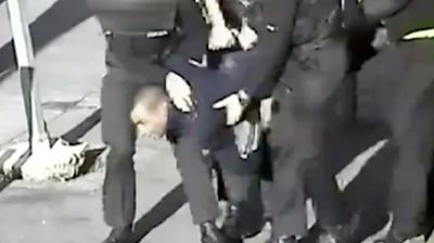 Leon Briggs carried by police