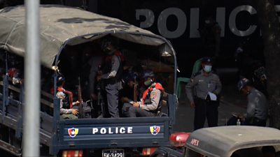 Myanmar police in vans