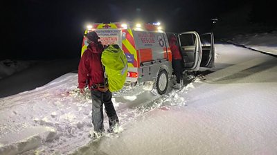 Rescue teams in snow