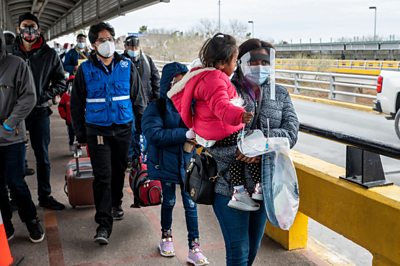 Asylum seekers enter Brownsville, Texas from Mexico.