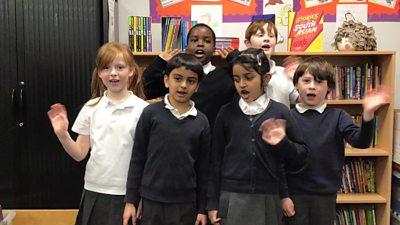 six-school-children-wave-to-camera