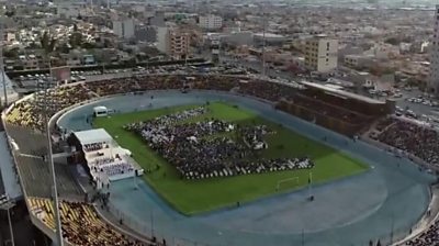 Picture showing people in stadium for Pope mass