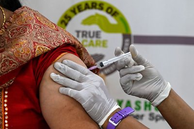 A woman getting the jab