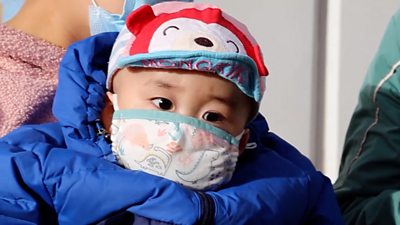 Baby with face mask