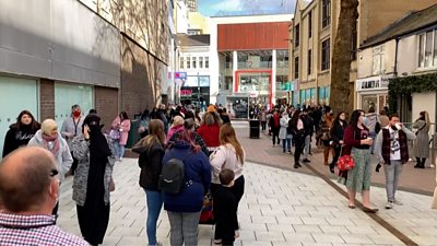 Shoppers queue as stores reopen in Cardiff following the second coronavirus lockdown