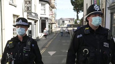 Police officers walking in the street
