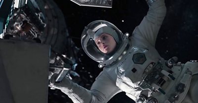 An in-post production shot from The Midnight Sky. Actress Felicity Jones is wearing a space suit