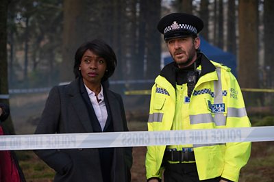 D.S. Holland (RAKIE AYOLA), Max (JASON HUGHES) in The Pact (Image Credit: BBC / Little Door (The Pact) / Warren Orchard)